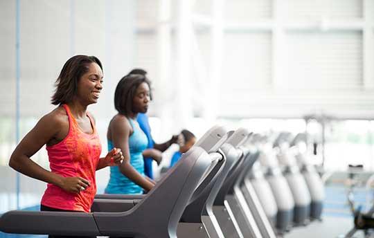 Residents using the Barclay Apartments fitness center