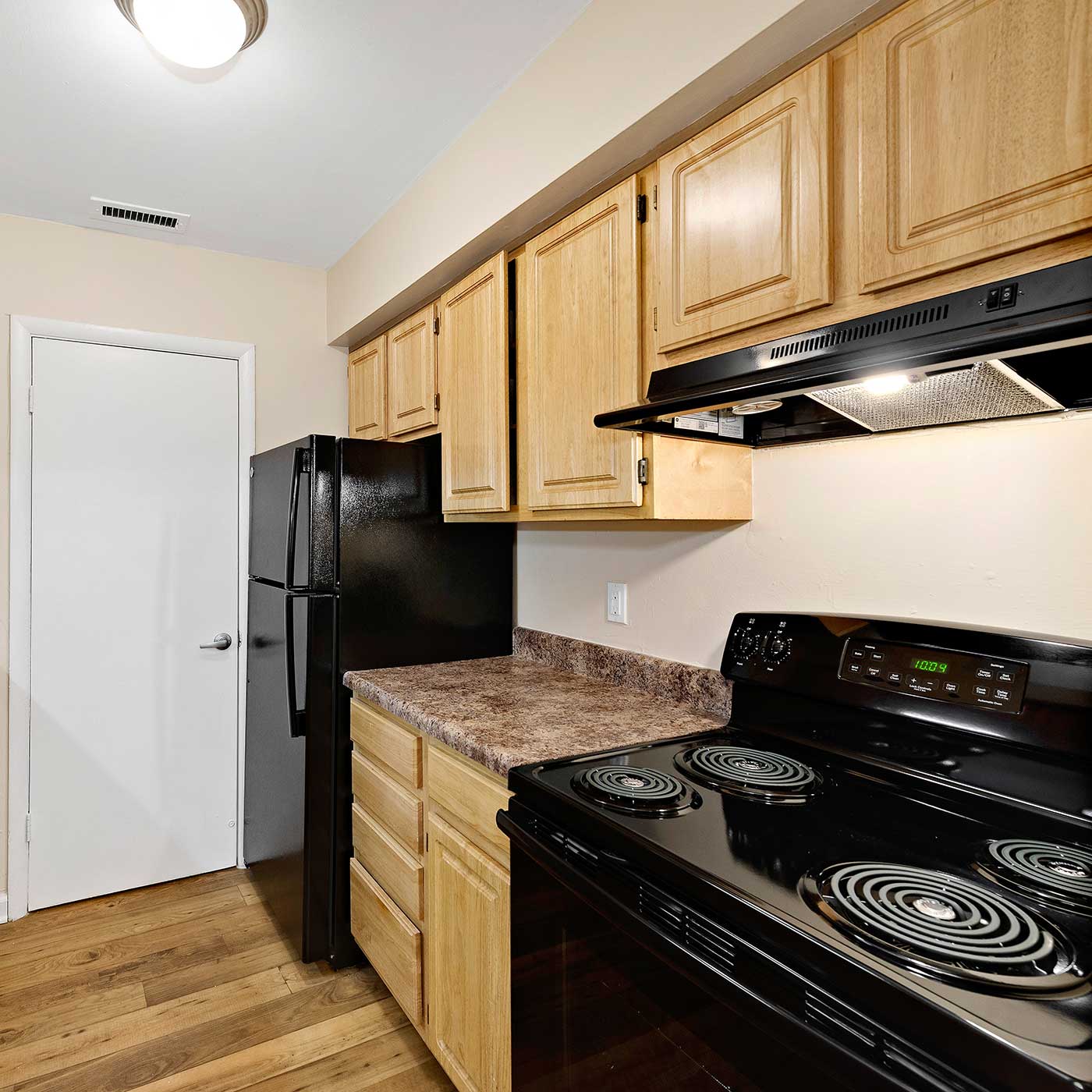 Granite counter tops and black appliances at EastView Communities