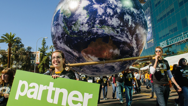 Sustainability homecoming parade with Partner sign