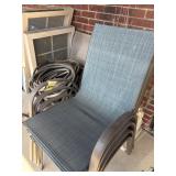 Stack of Four Patio Chairs