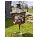 Wooden Birdhouse with Animal Figures standing