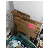 2 wooden folding chairs marked Steelers on them
