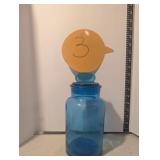 Blue jar glass with lid. Lid has crack