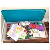 2 STORAGE CONTAINERS, 1 FULL  OF WRAPPING SUPPLIES