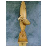 Carved Eagle Head over a Feather Wood Carving
