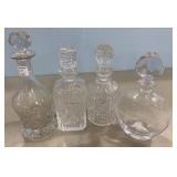 Four Pressed Glass Decanters