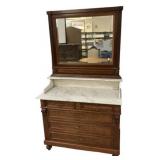 Eastlake Victorian marble top dresser with a mirro