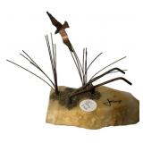 signed Mario Jason sculpture featuring a metal sea