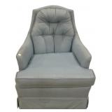 Light blue upholstered arm chair features a high,