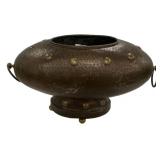 This vintage hammered metal planter or center piec