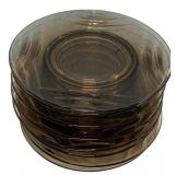 Eight Duralex glass plates feature a smoked brown
