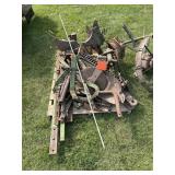 John Deere plow, disassembled, parts