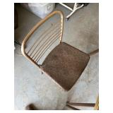 Metal leg table, four folding chairs.