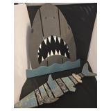 Two rustic wooden shark signs