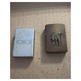 Two zippo lighters- XOMOX & partial Marlboro man