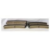 Eighteen Marklin HO Gauge curved sections of M track with variations