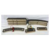Group of Marklin HO Gauge solid center rail curved, straight, feeder, R/C uncoupler track sections