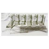 Twenty-four Marklin HO Gauge catenary poles and twenty-seven wires