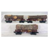 Three modern Lionel O Gauge West Side Lumber Company skeleton log cars with loads & chains