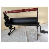 CAST IRON NEWSPAPER LOG ROLLER