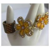 Two Floral Rings and One Band Ring