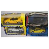 Four 1:24 Die-Cast Model Cars