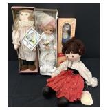 Four Different Cloth & Porcelain Dolls
