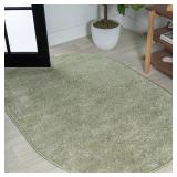 Haze Solid Low Pile Green 5 Ft. X 8 Ft. Oval Area