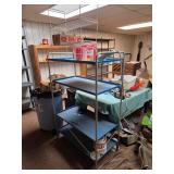 Metal Four-Tier Shelving Unit with Blue Shelves an