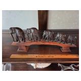 Hand-Carved Wooden Elephant Figurines on Wooden Br