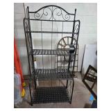 Black Metal Four-Tier Shelf with Decorative Scroll