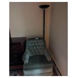 green chair and floor lamp