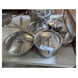 (5) all clad pots and pans 4 lids