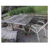 wooden table with two wire chairs