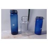 Two Blue Glass Canisters and One Clear Glass 