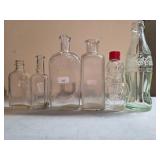 Six Glass Bottles, Including Coca-Cola and Novelty