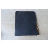 Black 3-Ring Binder with Handwritten Notes and Ass