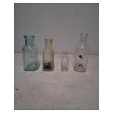 4 Assorted Glass Bottles with Varied Sizes
