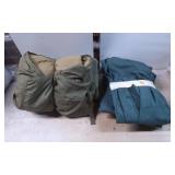 Three Teal Coats and One Green Sleeping Bag