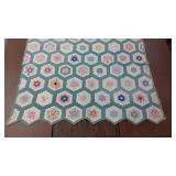 Green & White Patterned Quilt