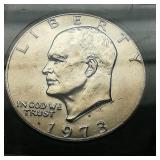 1973 S Eisenhower $1 BRILL UNCIRC B