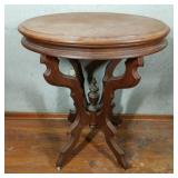 Oval Walnut Parlor Table with Porcelain Casters
