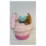 Pink rope lined basket with bunny plushies