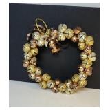 Decorative holiday jingle bell wreath crafted