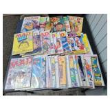 Assorted Vintage MAD Magazines on Carboard