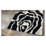 6.7ft x 4.11ft White and Black Rug