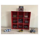 Red Shelf of Assorted Toy Race Cars