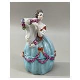 Victorian-style porcelain figurine of a lady