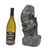 Two Figures Intertwined in Hands Sculpture