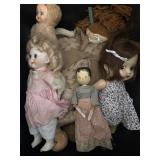 Tote of vintage dolls